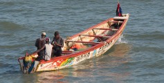 Fun Geography for Kids on Gambia - Image of a Brightly Painted Fishing Boat Common in Bakau, Gambia